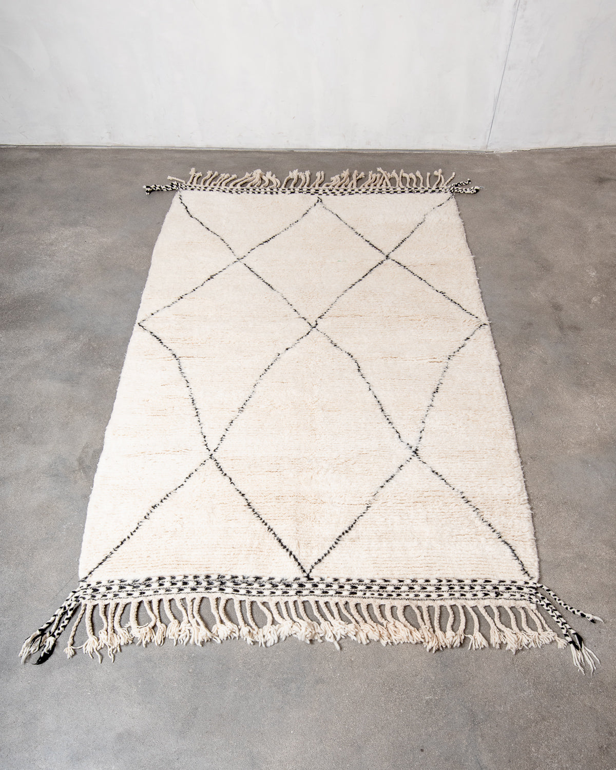 Modern, designer, handcrafted Berber rug from Morocco. Beniourain carpet with minimalist design, natural wool pile and a fluffy texture.
